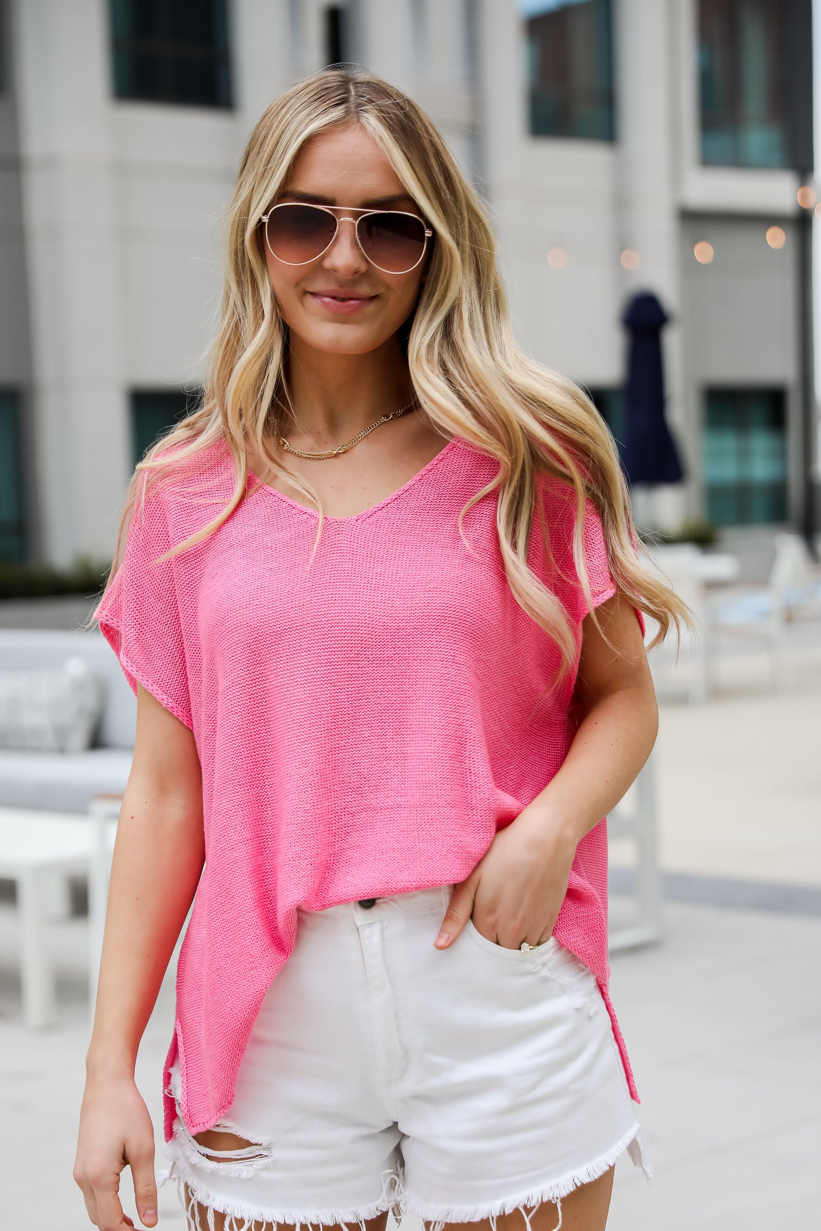 hot pink knit tee, Eliza Lightweight Knit Top is the perfect spring sweater. Lightweight knit sweater, with v-neck, short sleeves, and oversized fit. Pairs well with denim. Online boutique.